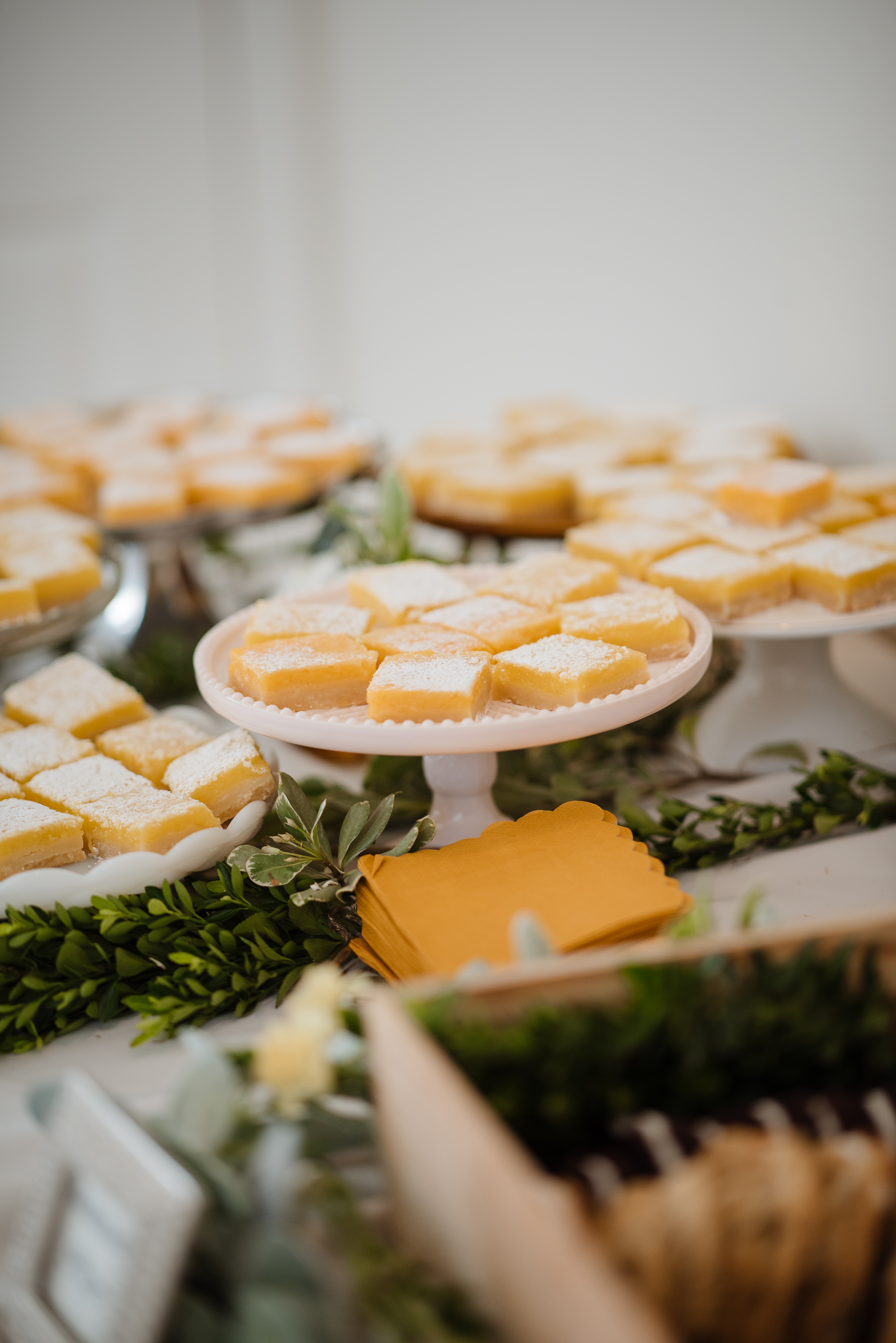 lemon bars on cake stands